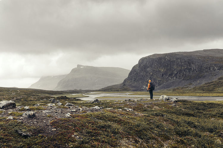 Rear view of hiker in mountains