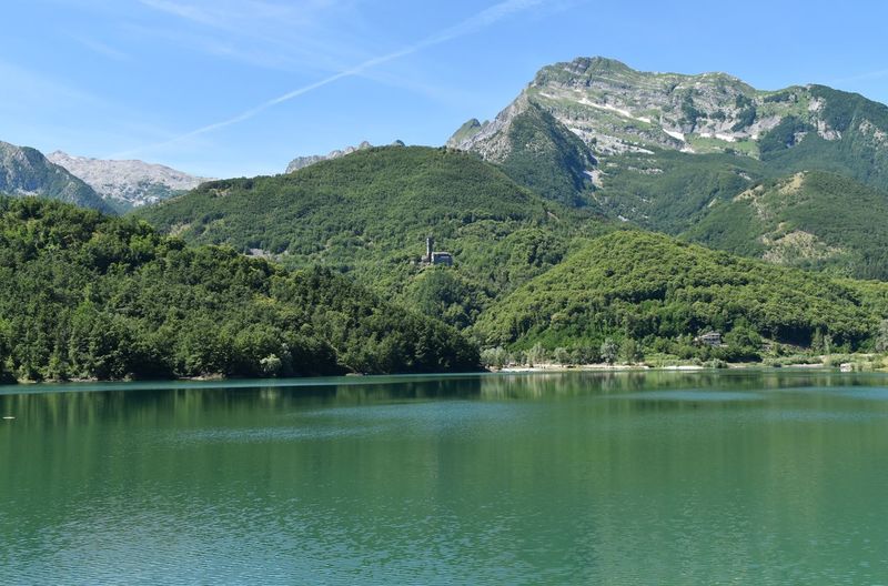 Scenic view of lake and mountains against sky