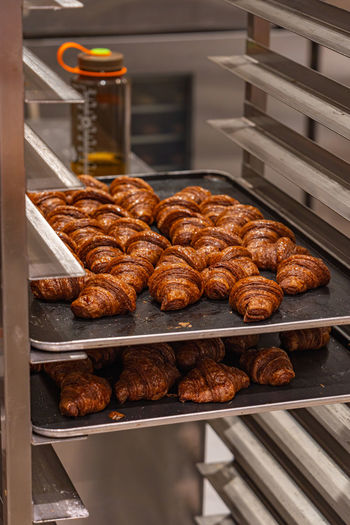 Fresh baked croissant on cooling rack at pastry shop