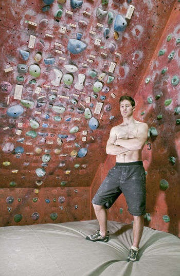 Man bouldering at indoor gym in england
