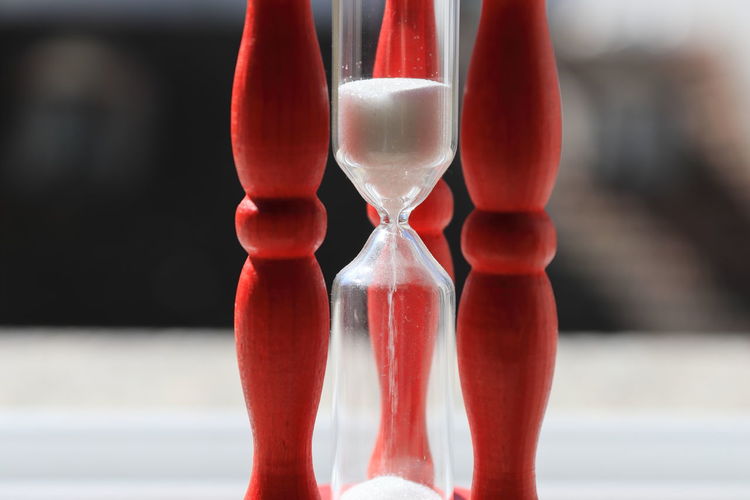 Close-up of red hour glass 