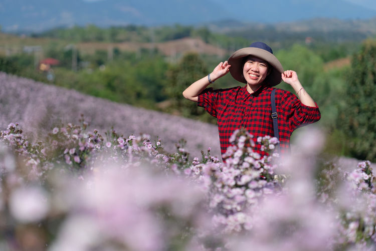 Young woman standing on field