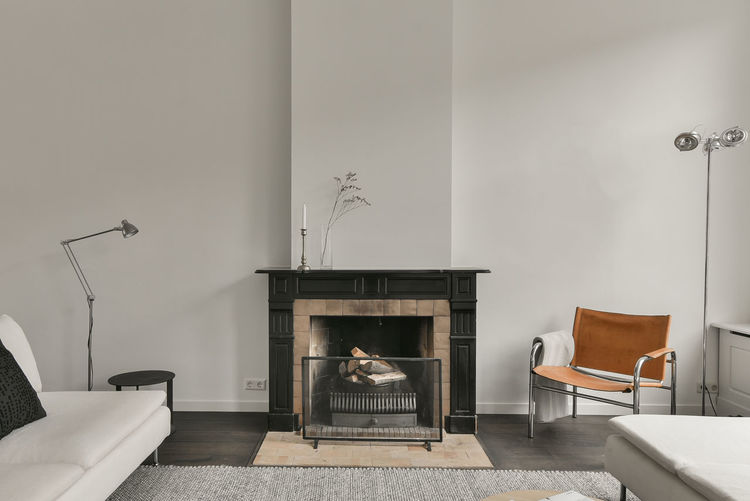 Cozy living room with a fireplace in apartment