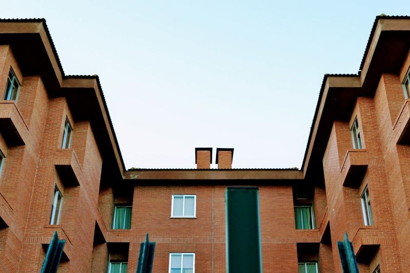 Low angle view of residential building against sky