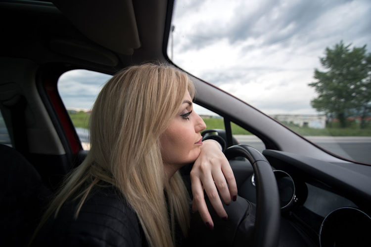 Portrait of woman in car