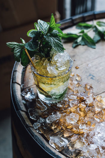  mint julep cocktail with bourbon, fresh mint, crushed ice on whiskey barrel