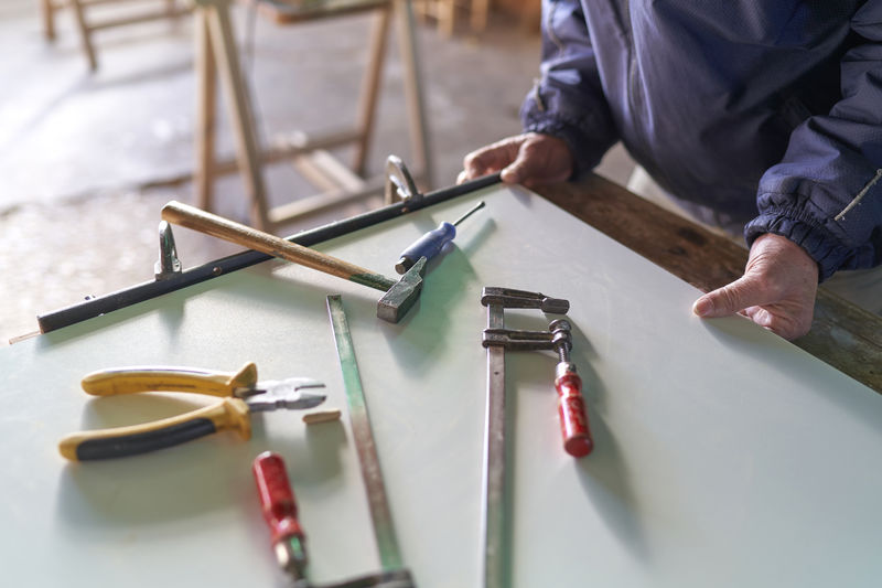 High angle view of man working on table