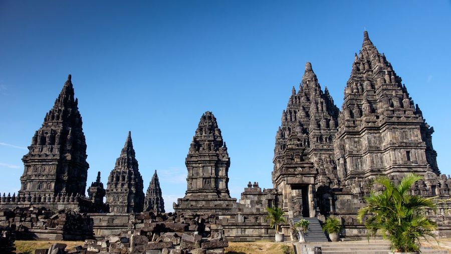 Stupas of building against clear blue sky