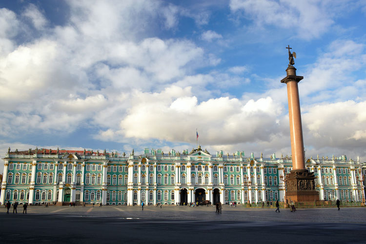 Alexander column and winter palace against sky