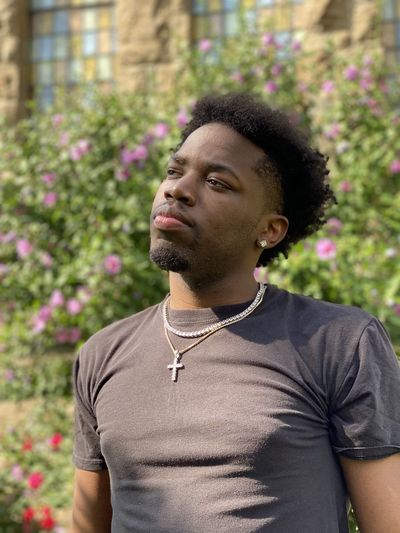 Portrait of ae budis, an upcoming rapper from upstate new york. 