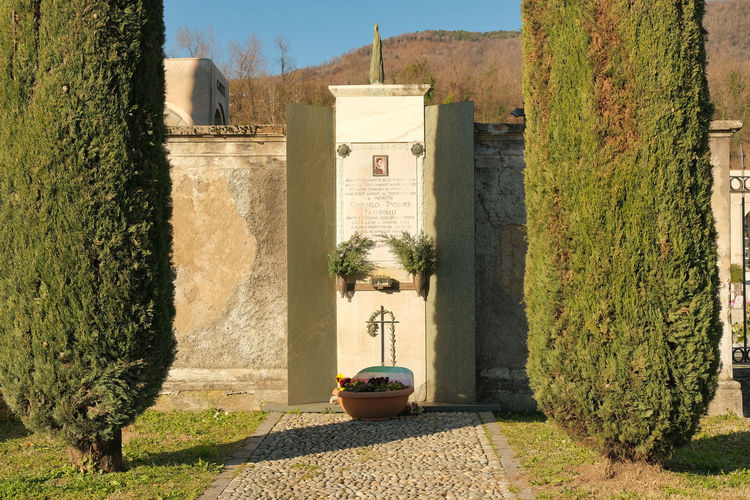 Commemorative plaque where giancarlo puecher passavalli was shot, outside the erba cemetery, in ital
