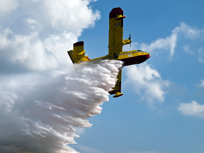 Firefighting aircraft drops load of water from the sky