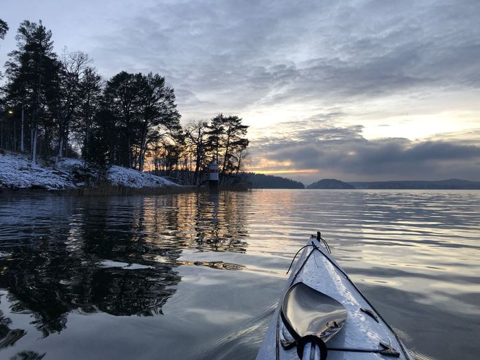 Scenic view of lake against sky during sunset