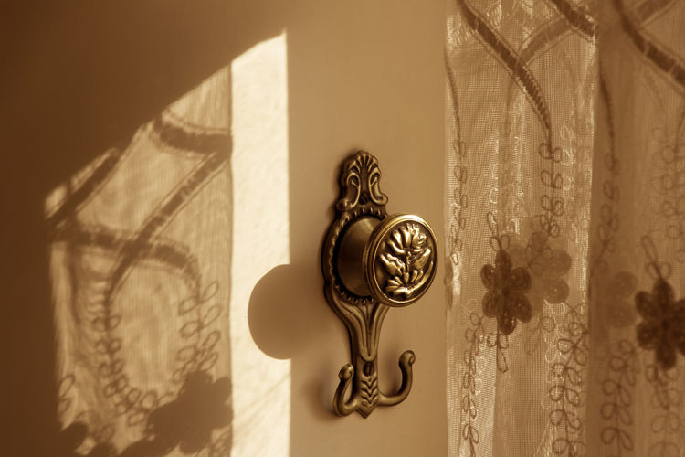Close-up of doorknob at home