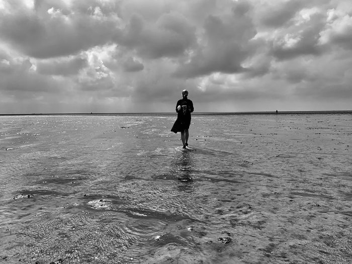 Woman walking on wattenmeer 