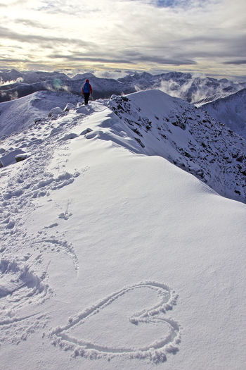 High angle view of heart shape on snowcapped mountain