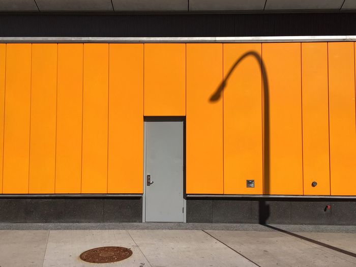 Shadow of street light on building wall