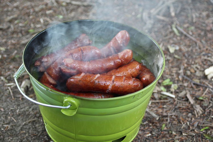 View of hot sausages in green bucket