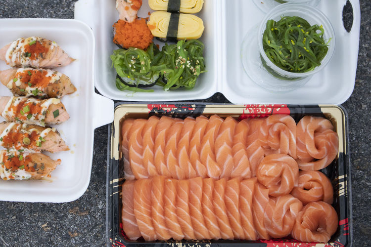 High angle view of various fish in container