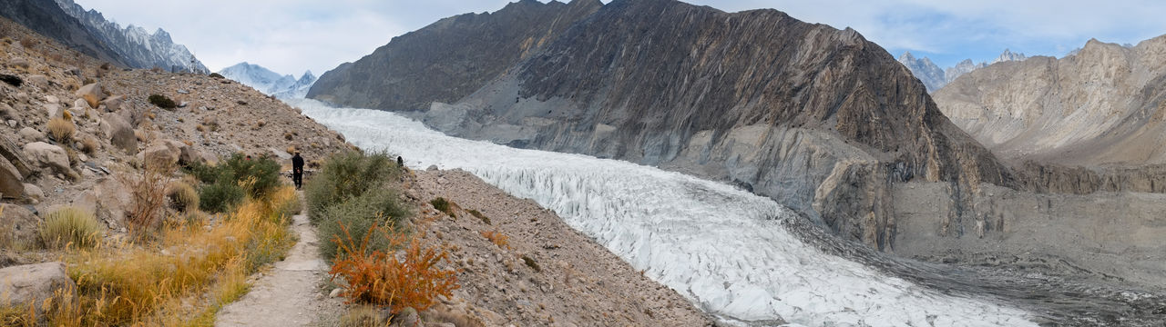Panoramic view of white passu glacier surrounded by karakoram mountains. gilgit baltistan, pakistan.