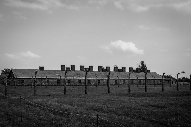 Built structure on field against sky