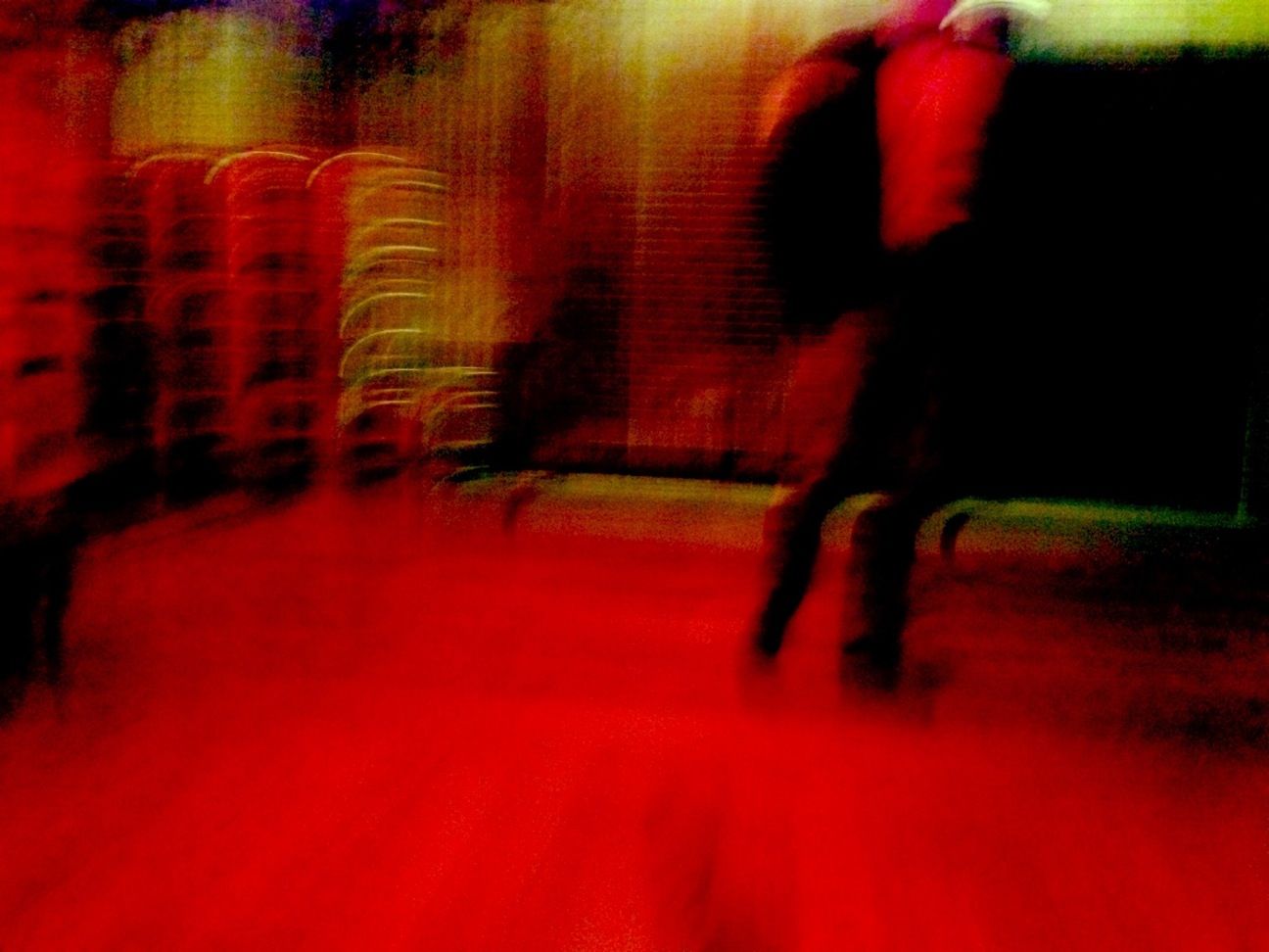 red, lifestyles, blurred motion, leisure activity, men, unrecognizable person, person, illuminated, motion, rear view, standing, indoors, walking, night, reflection, selective focus, defocused, on the move