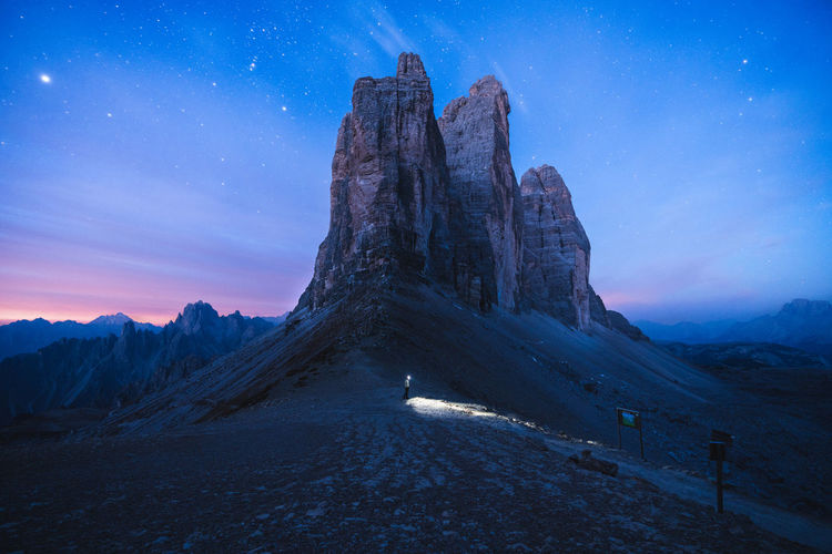 ROCK FORMATIONS ON LANDSCAPE AGAINST SKY