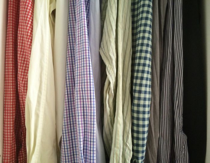 Close-up of shirts hanging in closet