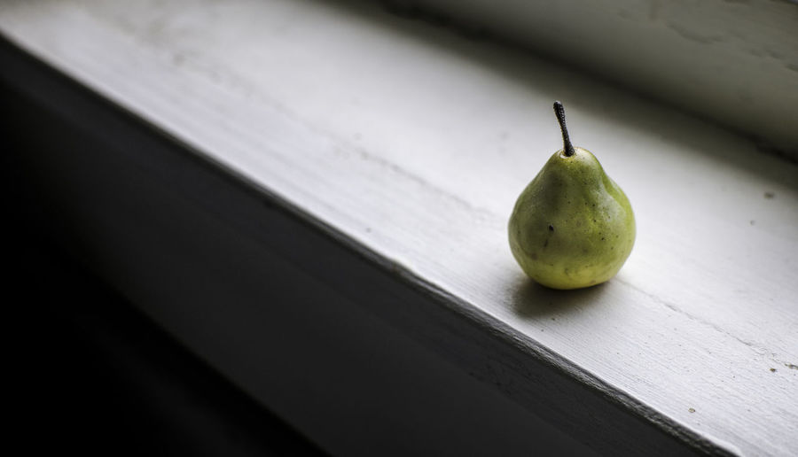 Close-up of pear on table