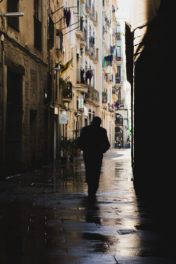 Rear view of a silhouette man in rain