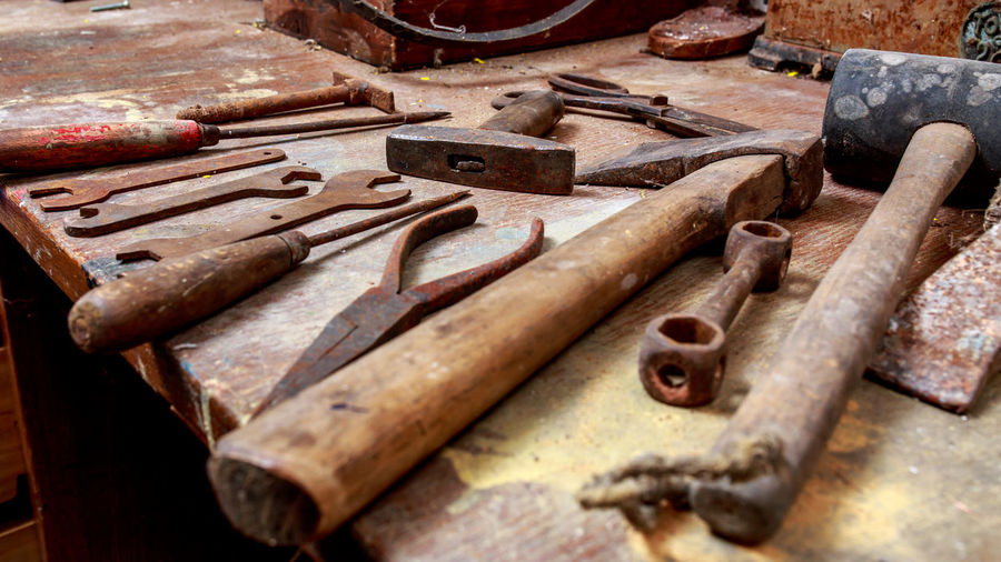 Close-up of rusty tools on table