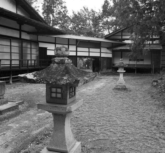 Exterior of building by trees and house