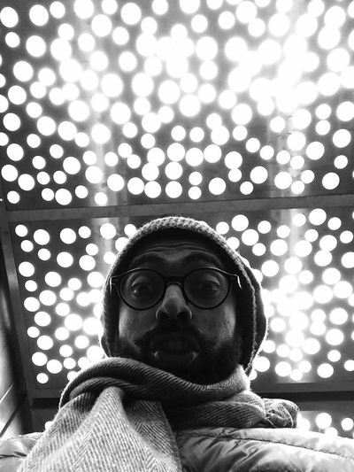 Low angle view of man wearing eyeglasses at home