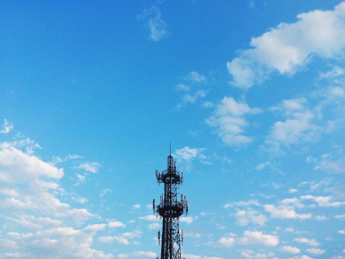 Low angle view of repeater tower against sky