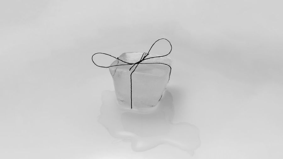 High angle view of wineglass on table against white background