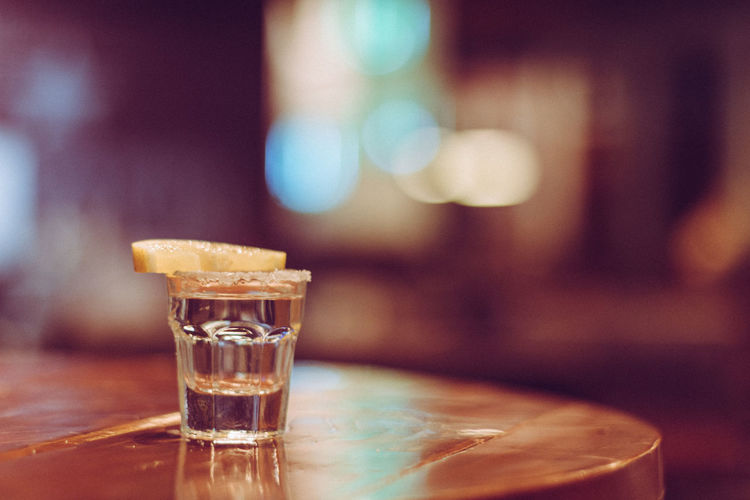 Close-up of tequila shot on table