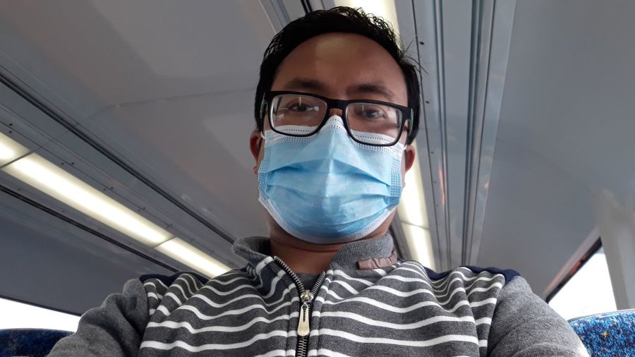 Portrait of man with protective face mask in ambulance