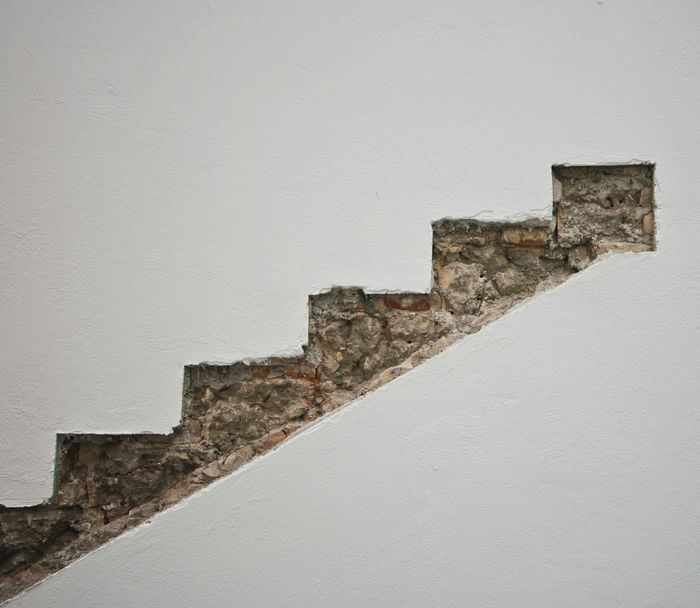 Steps by wall in building