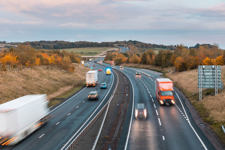High angle view of vehicles on road against sky